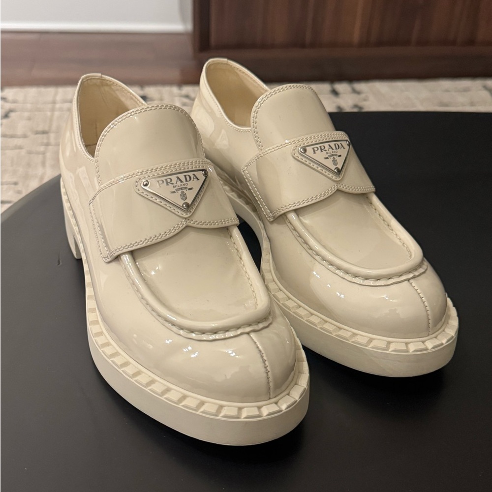Prada women’s Glossy Cream Slip-On Loafers